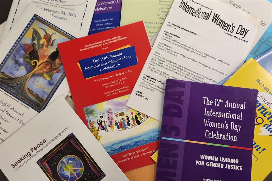 [ai] Various flyers and brochures related to International Womenâ€™s Day celebrations. The documents feature colorful designs and information about events from different years, emphasizing themes of gender justice and community engagement.